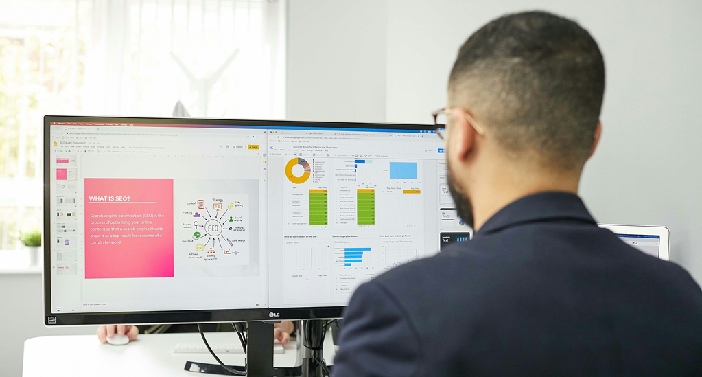 A man staring at his computer monitor - What is SEO
