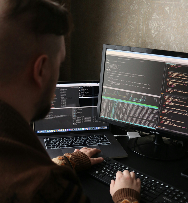 Computer Expert Working On A Desktop