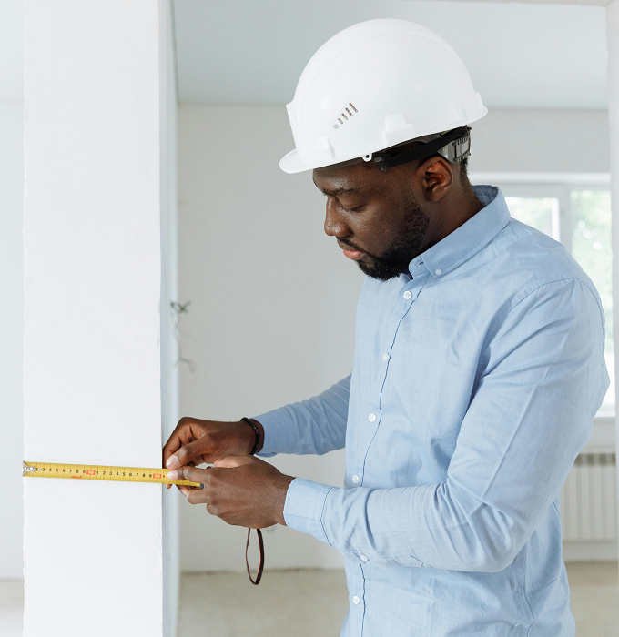 House Renovation - Worker Measuring