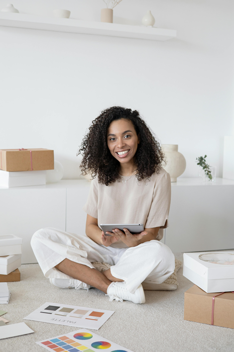 Lady Entrepreneur Seated On The Floor Working