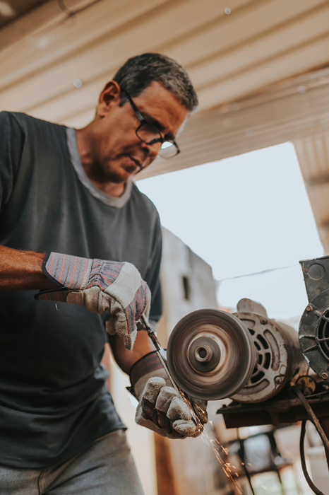 Man Working On His Tools In His Workshop