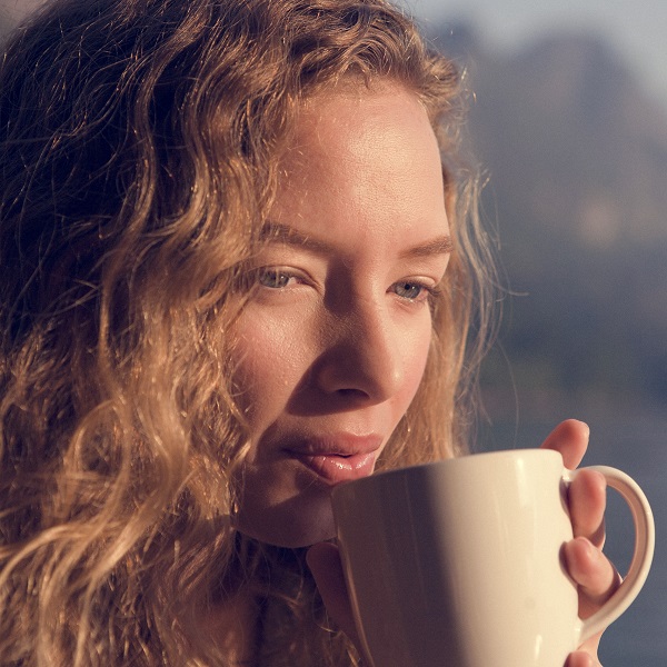 Woman warm in the morning sun