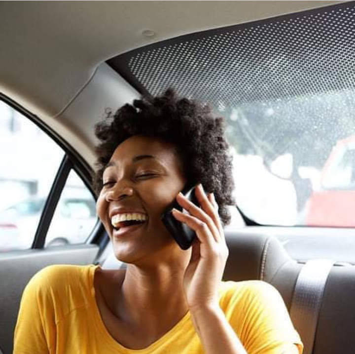 lady in the car Laughing Wearing A Yellow T-Shirt