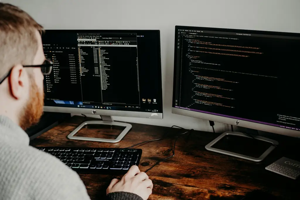 Muumba Web Digital - Web Developer Working On Two Desktops