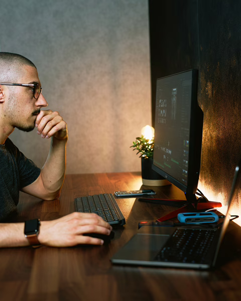 MWD - A Man Working On His Computer At His Desk