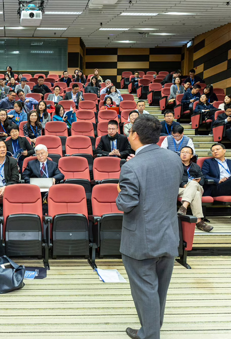 MWD Man Speaking In Front of An Audience At An Event