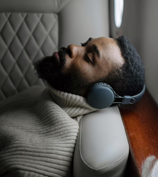 MWD - Black Man Laying On Sofa Listening to Audio
