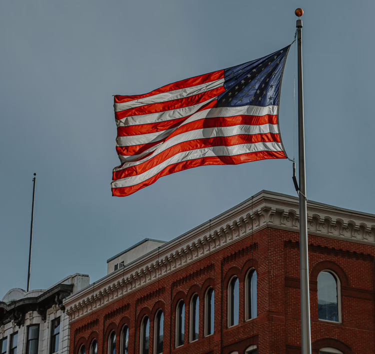 MWD US Flag Over Office Building
