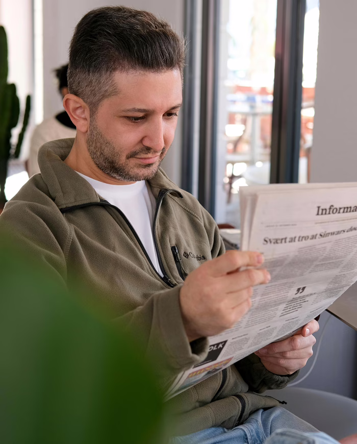 MWD - White Man Reading A Newspaper