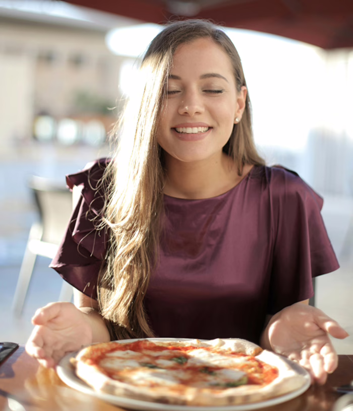 MWD-Young-Lady-Holding-a-Hot-Pizza