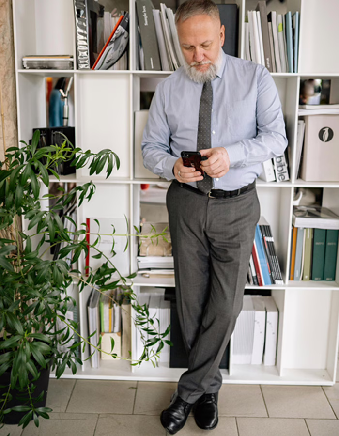 Mature-Man-Checking-His-Phone